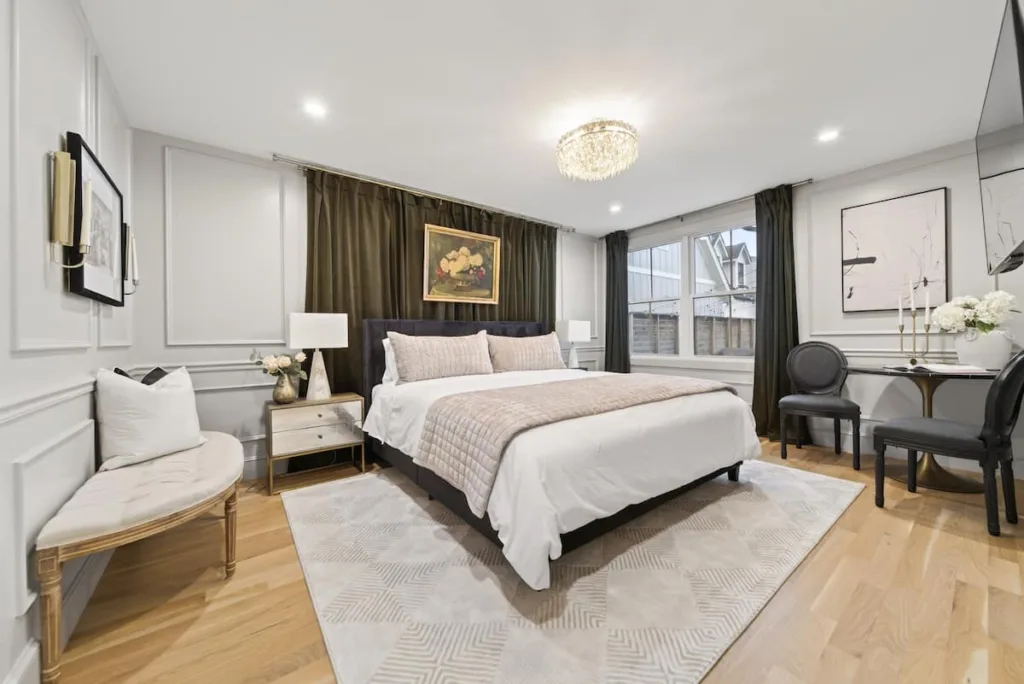Primary bedroom with king bed in White Porch Retreat